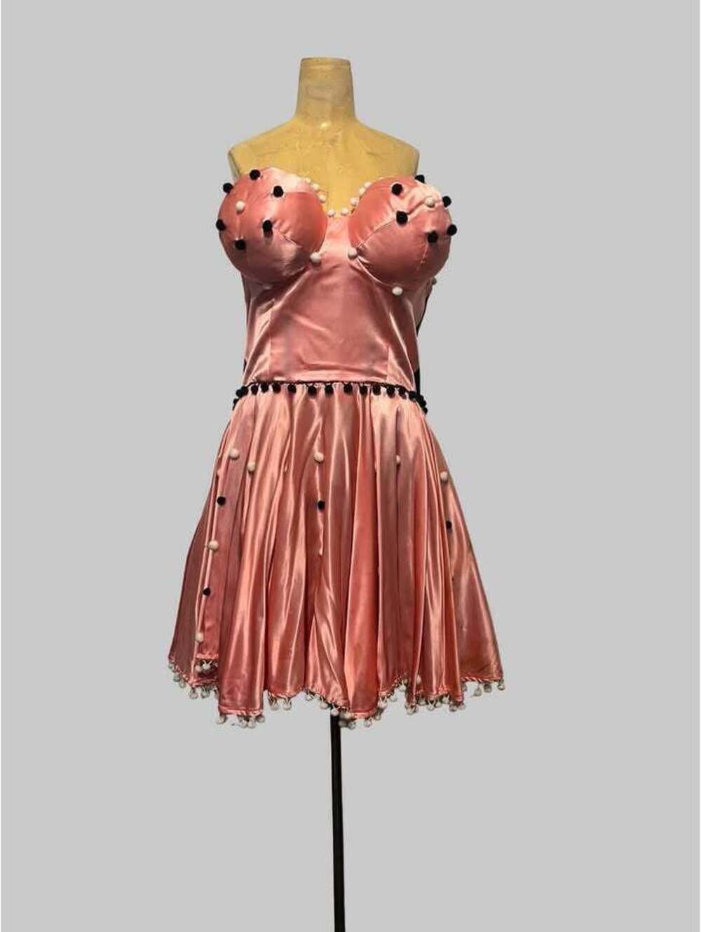 Pink Satin Pom-Pom Corset Mini Dress Costumes with clownish breasts.